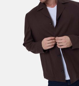 قميص فضفاض بأكمام طويلة وصف أزرار