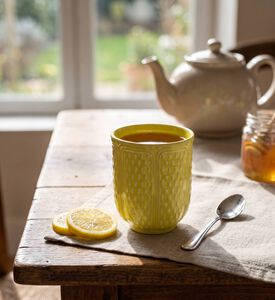 Gien Citron Embossed Tea Cup, Model View