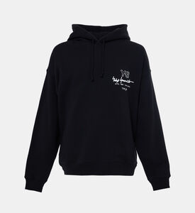 هودي فضفاض مضلع بطبعة شعار