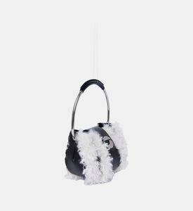 الحقيبة الدائرية المزخرفة من جلد العجل