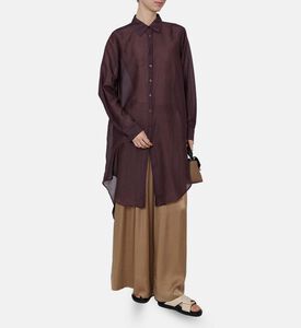 قميص شفاف بأكمام طويلة وصف أزرار