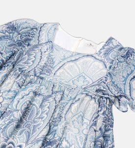 فستان بقصّة هرمية وأكمام منفوشة ونقشة أزهار