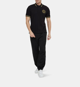 قميص بولو بتطريز ذهبي