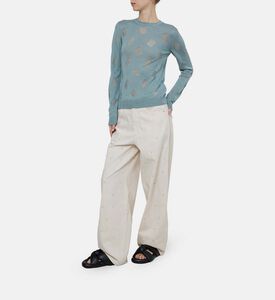 كنزة محبوكة بياقة دائرية وتفاصيل مثقبة