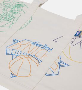 حقيبة يد مطبوعة برسومات فريق إن بي آي