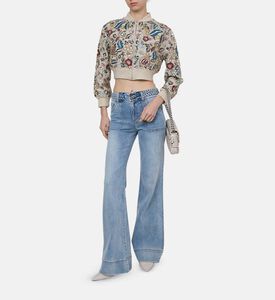 جينز واسع فاتح بخصر مرتفع أعلى الأرداف