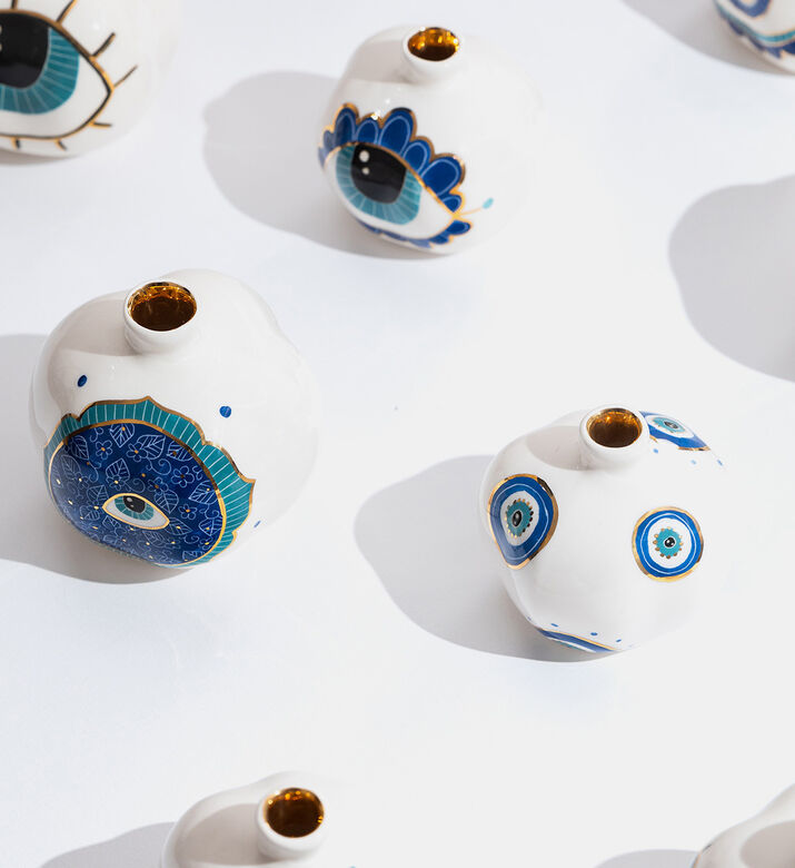 زينة رمان مزججة بلون ذهبي مستوحاة من العين الشريرة