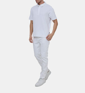 بنطال جينز بخصر متوسط وقصّة ضيقة