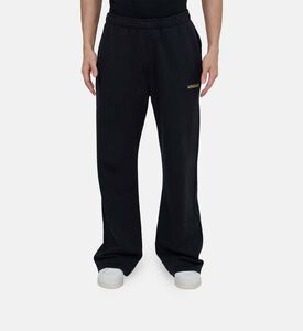 بنطال عريض الساقين بتفاصيل شعار