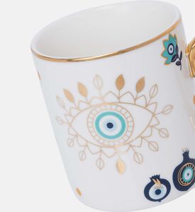 كوب بمقبض ذهبي بشكل عين شريرة