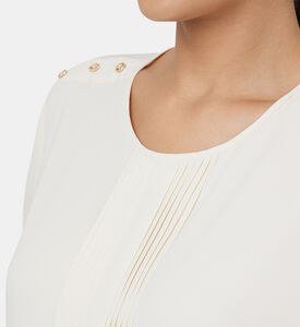 مطوي بأكمام قصيرة الأعلى