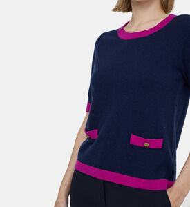 كنزة صوفية بجيوب أمامية بلون مغاير