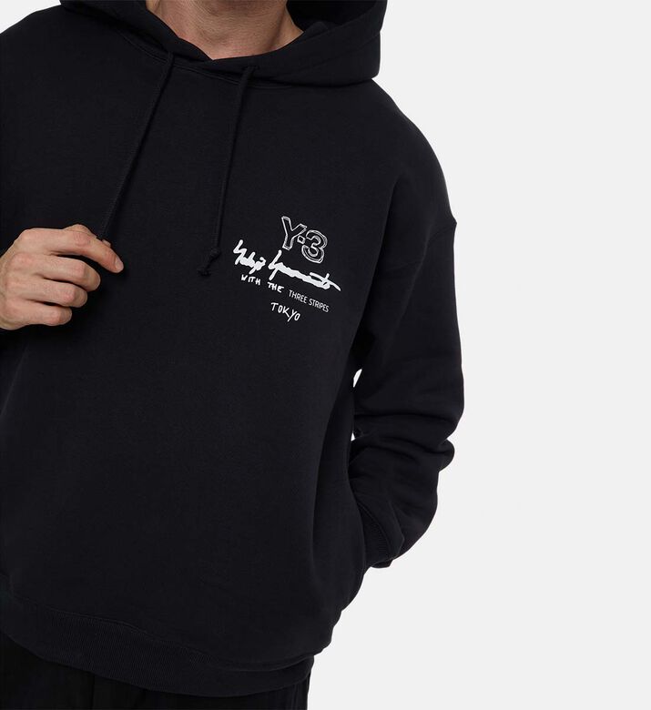 هودي فضفاض مضلع بطبعة شعار