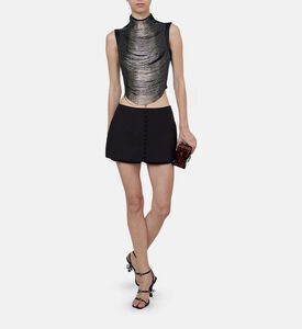 بلوزة بياقة عالية مزينة بشراشيب معدنية