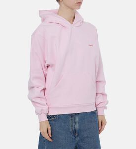 هودي بقصّة فضفاضة وشعار مطبوع على الصدر