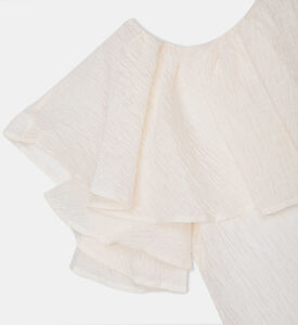 بلوزة بأكمام منفوشة غير متماثلة