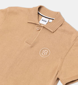 قميص بولو بأكمام قصيرة مخططة وأساور مضلع