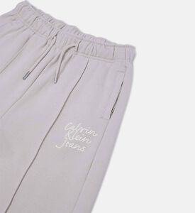 بنطال رياضي واسع الساقين مطرز بشعار