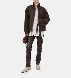 بلوزة محبوكة بياقة بشكل حرف في