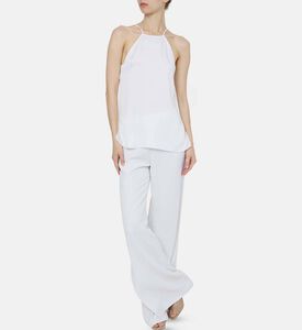 بلوزة ساتان مقلوب مزينة بسلسلة معدنية