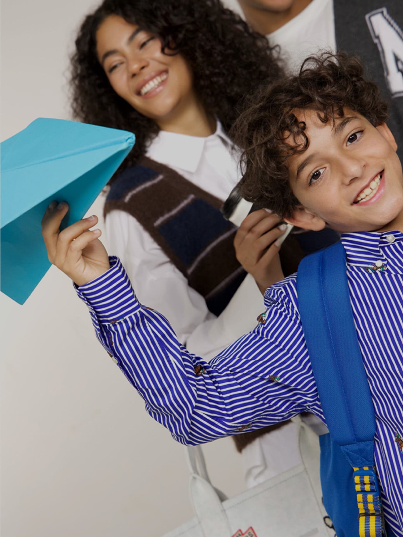 Image of kids and teens in school outfits